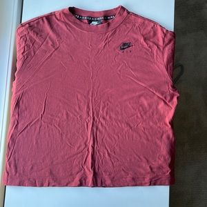 This is a maroon long sleeve tee from nike. It is in a size women’s medium.